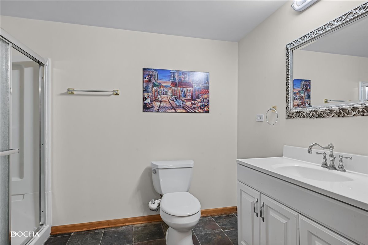 1107 Tuthill Road Naperville, IL 60563 - Photo 46 of 59 a bathroom with a toilet sink and mirror