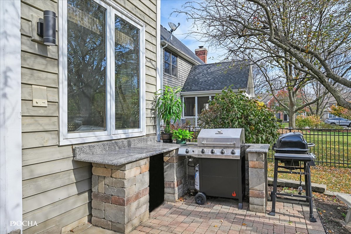 1107 Tuthill Road Naperville, IL 60563 - Photo 49 of 59 a view of a patio with table and chairs and potted plants