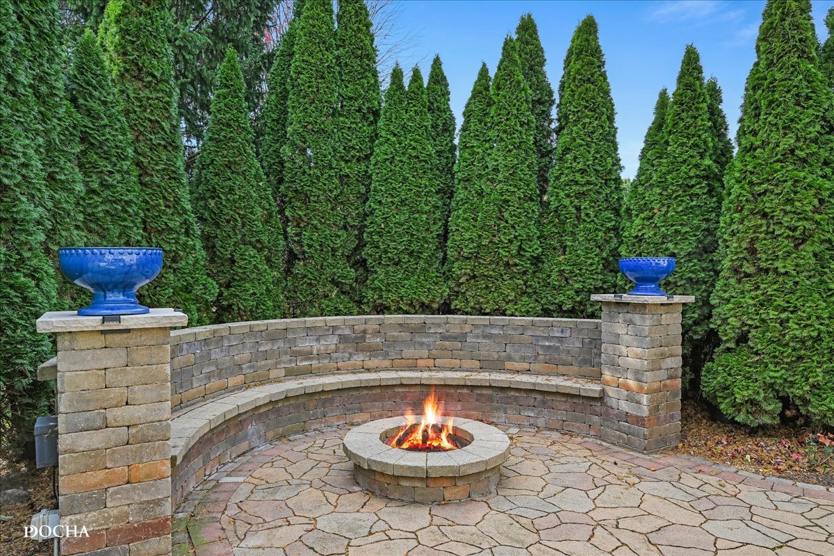 1107 Tuthill Road Naperville, IL 60563 - Photo 51 of 59 a view of a porch with furniture and a potted plant