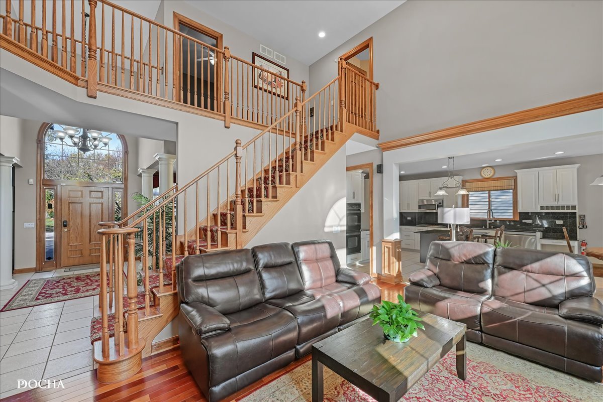 1107 Tuthill Road Naperville, IL 60563 - Photo 9 of 59 a living room with furniture or stairs and a wooden floor