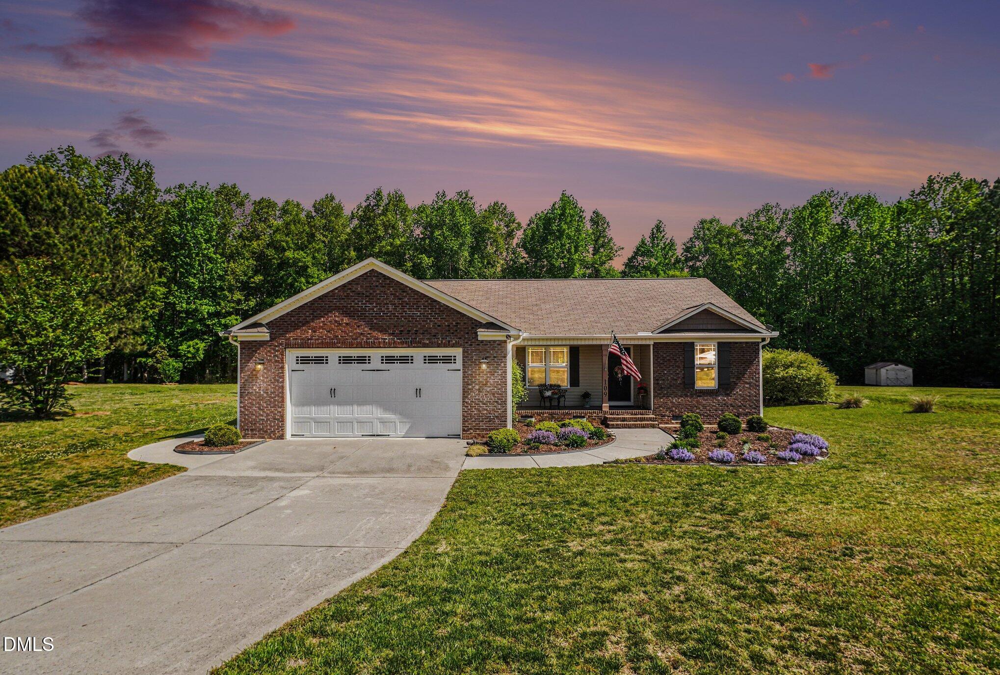 109 His Way Middlesex, NC 27557 - Photo 1 of 21 a front view of a house with garden