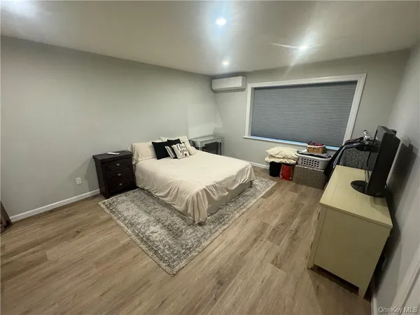a bedroom with a bed and a couch
