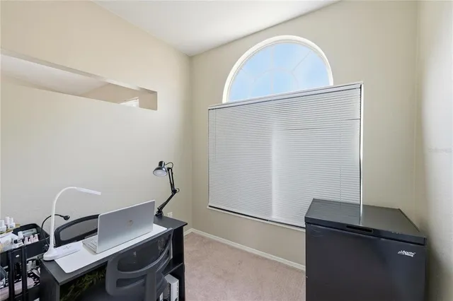 a workspace with furniture and window