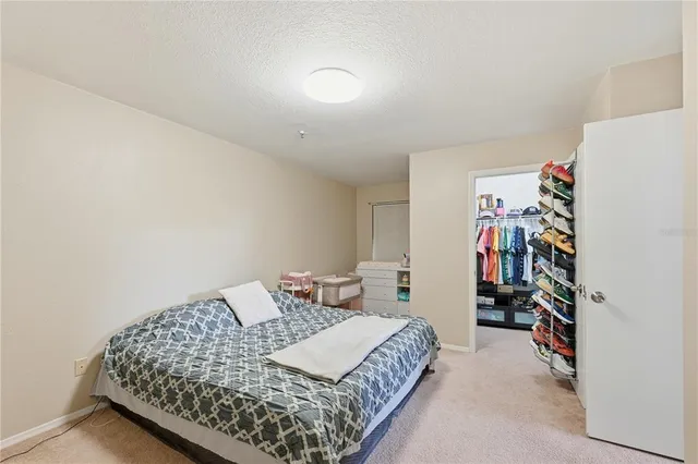 a bedroom with a bed and a walk in closet