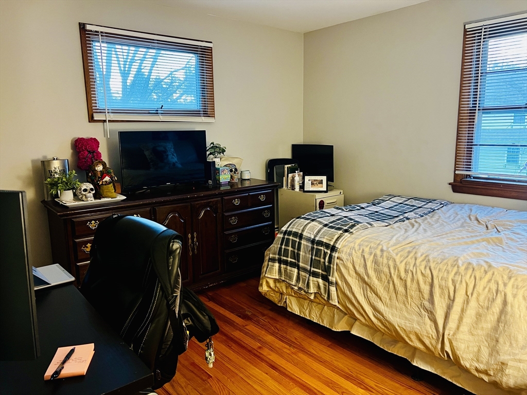 62 Arnold Road Sturbridge, MA 01518 - Photo 12 of 28 a bedroom with a bed and wooden floor