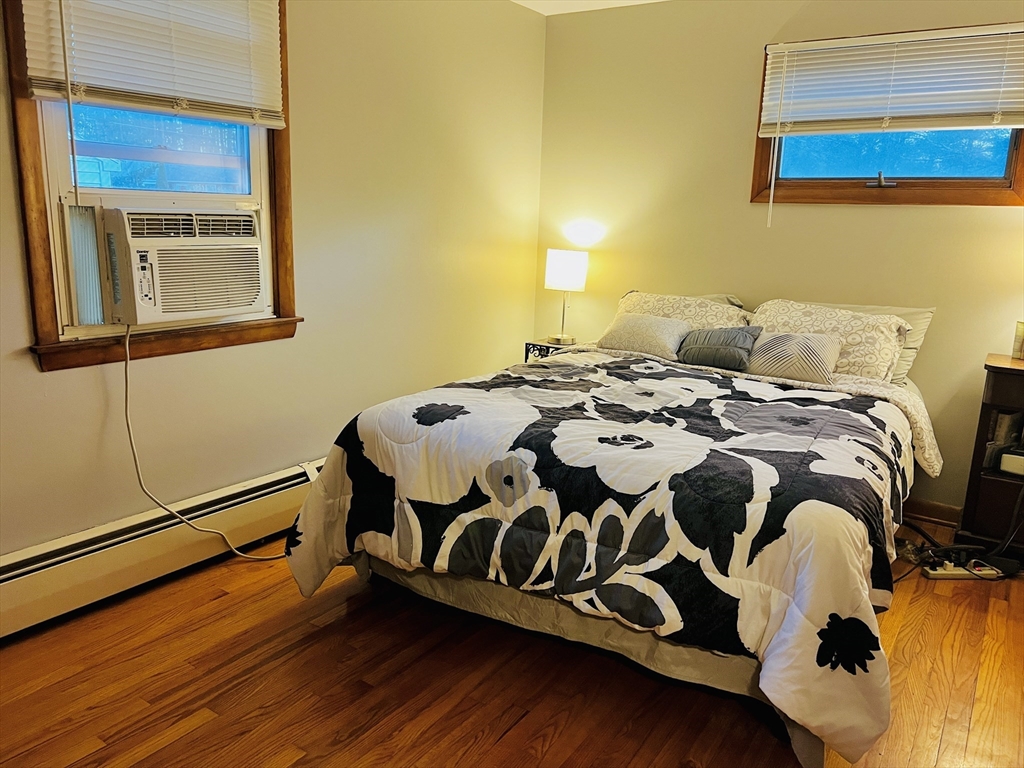 62 Arnold Road Sturbridge, MA 01518 - Photo 15 of 28 a bedroom with a bed and wooden floor