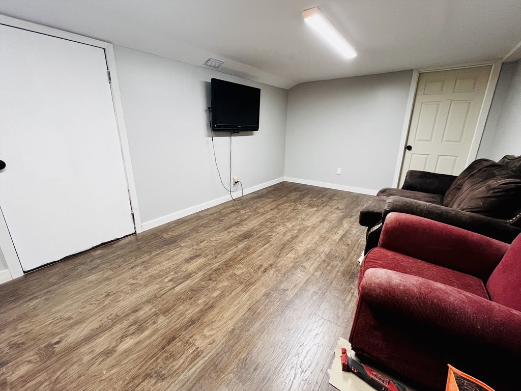 62 Arnold Road Sturbridge, MA 01518 - Photo 18 of 28 a living room with furniture and a flat screen tv