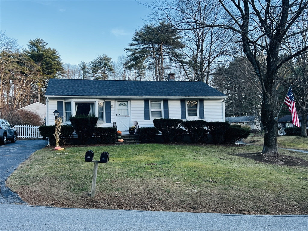 62 Arnold Road Sturbridge, MA 01518 - Photo 2 of 28 a front view of a house with a yard and trees