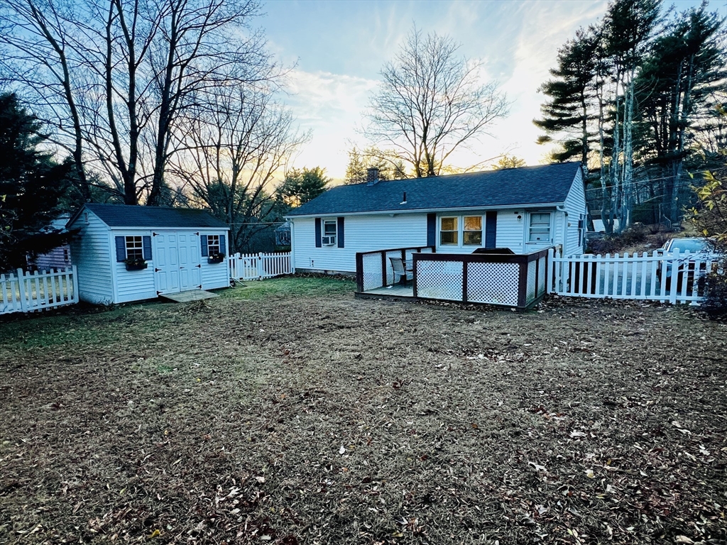 62 Arnold Road Sturbridge, MA 01518 - Photo 25 of 28 a house that has a tree in front of it