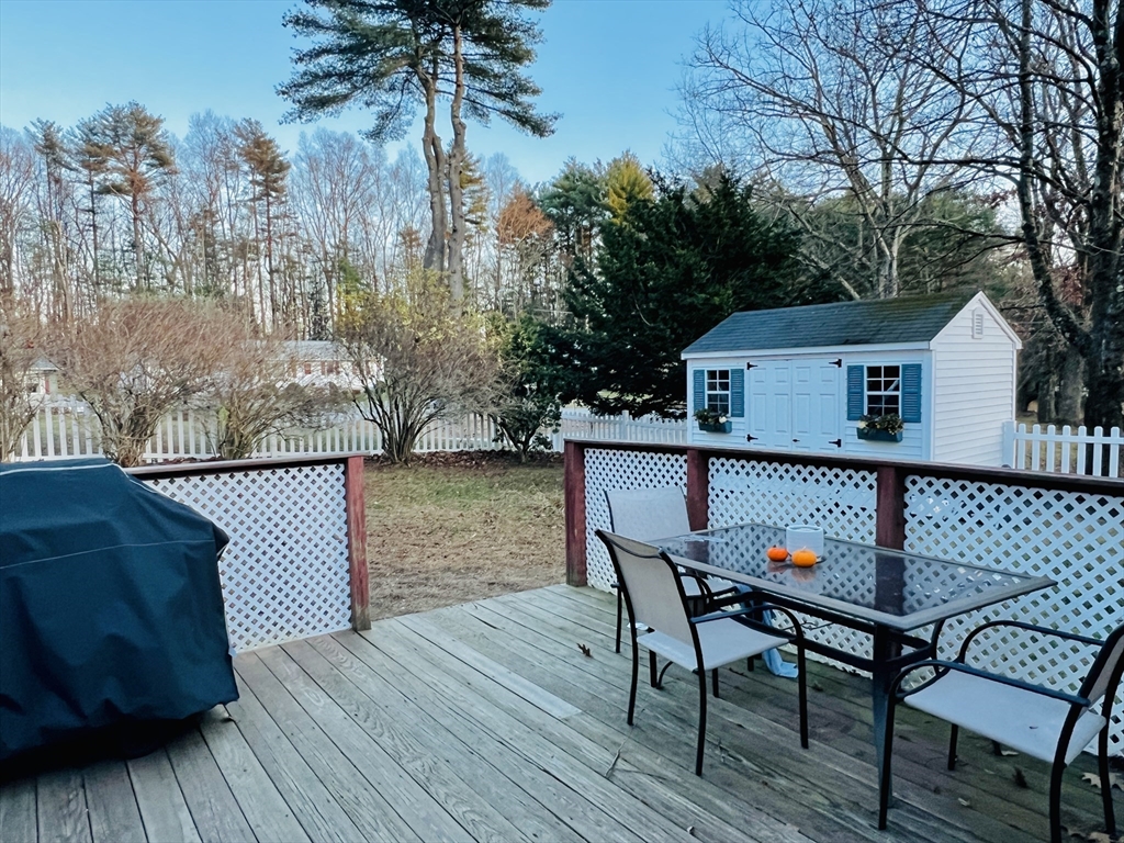 62 Arnold Road Sturbridge, MA 01518 - Photo 26 of 28 a view of a chairs and table on the deck