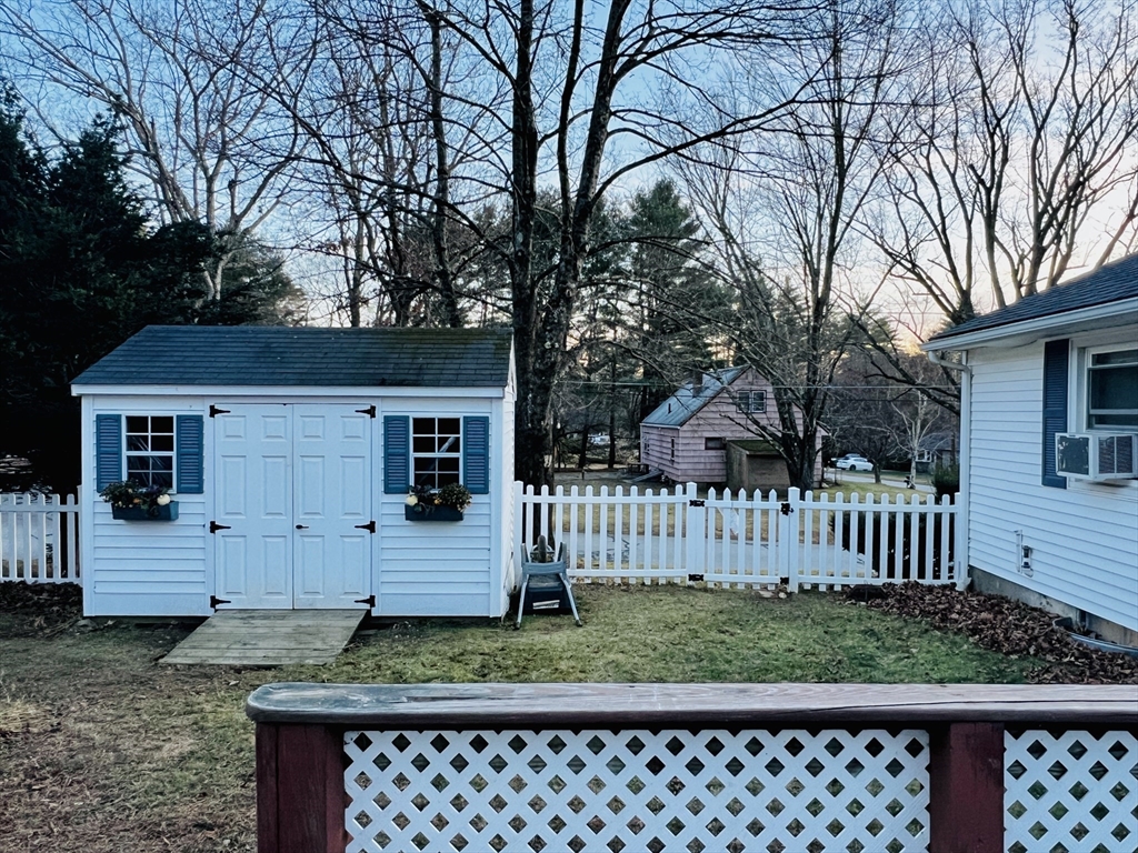 62 Arnold Road Sturbridge, MA 01518 - Photo 27 of 28 a view of a house with wooden fence