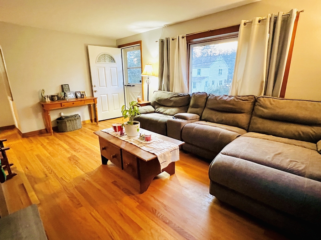 62 Arnold Road Sturbridge, MA 01518 - Photo 3 of 28 a living room with furniture and a large window