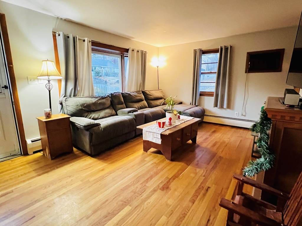 62 Arnold Road Sturbridge, MA 01518 - Photo 4 of 28 a living room with furniture and a flat screen tv