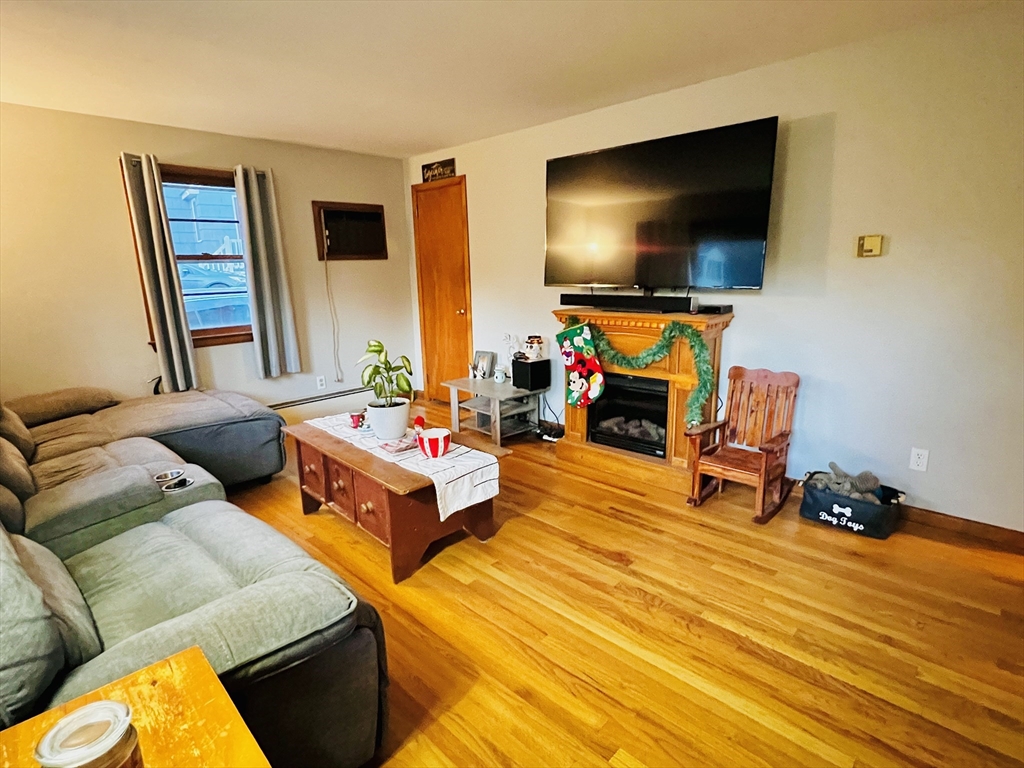62 Arnold Road Sturbridge, MA 01518 - Photo 5 of 28 a living room with furniture and a flat screen tv