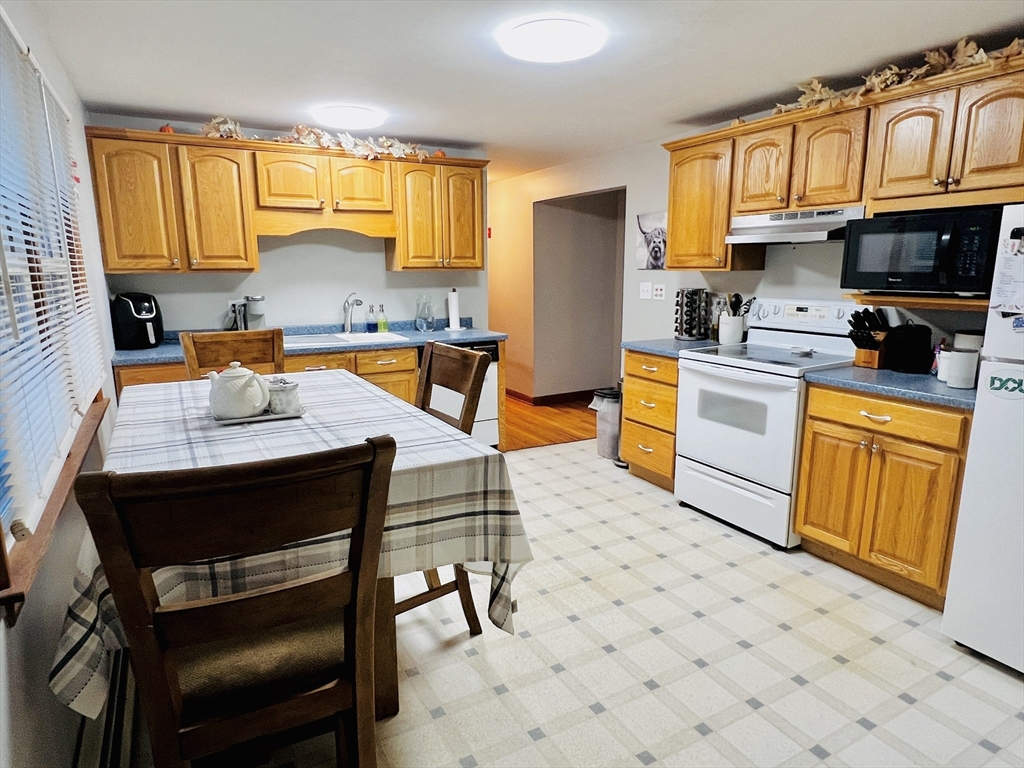 62 Arnold Road Sturbridge, MA 01518 - Photo 8 of 28 a kitchen with stainless steel appliances a stove a sink dishwasher and a refrigerator
