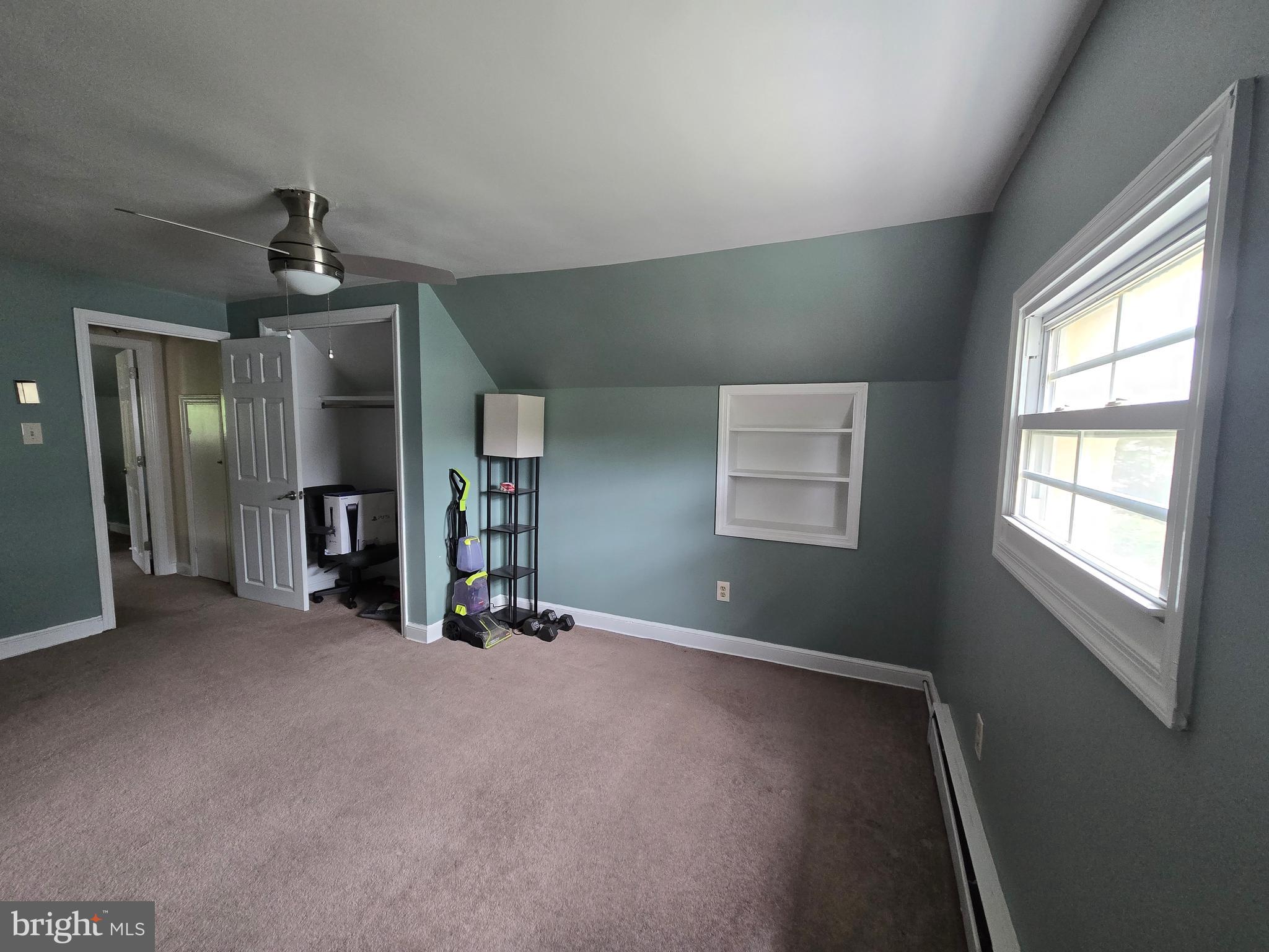 1492 Faulkland Road Wilmington, DE 19805 - Photo 15 of 23 an empty room with chandelier fan and windows
