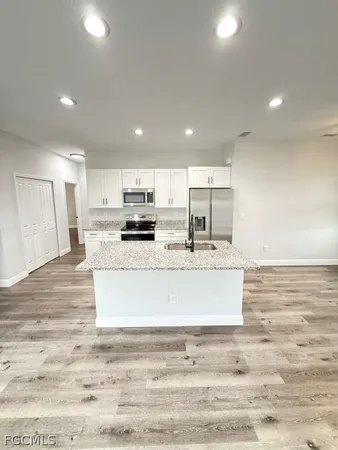 a view of kitchen with wooden floor