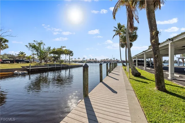 a view of a lake with palm trees