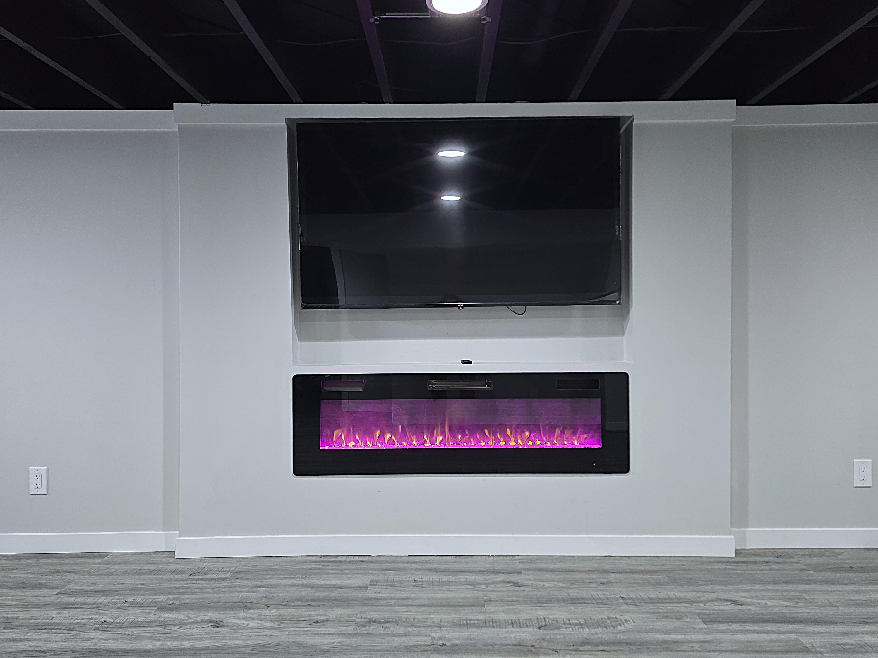 8114 West Congress Street Milwaukee, WI 53218 - Photo 30 of 39 Rec Room TV and Fireplace