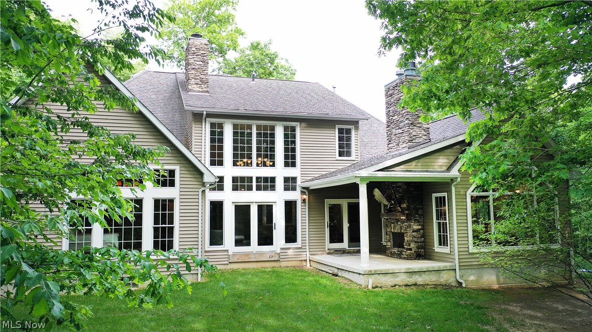 6868 River Styx Road Medina, OH 44256 - Photo 3 of 35 Covered patio with a beautiful stone fireplace.
