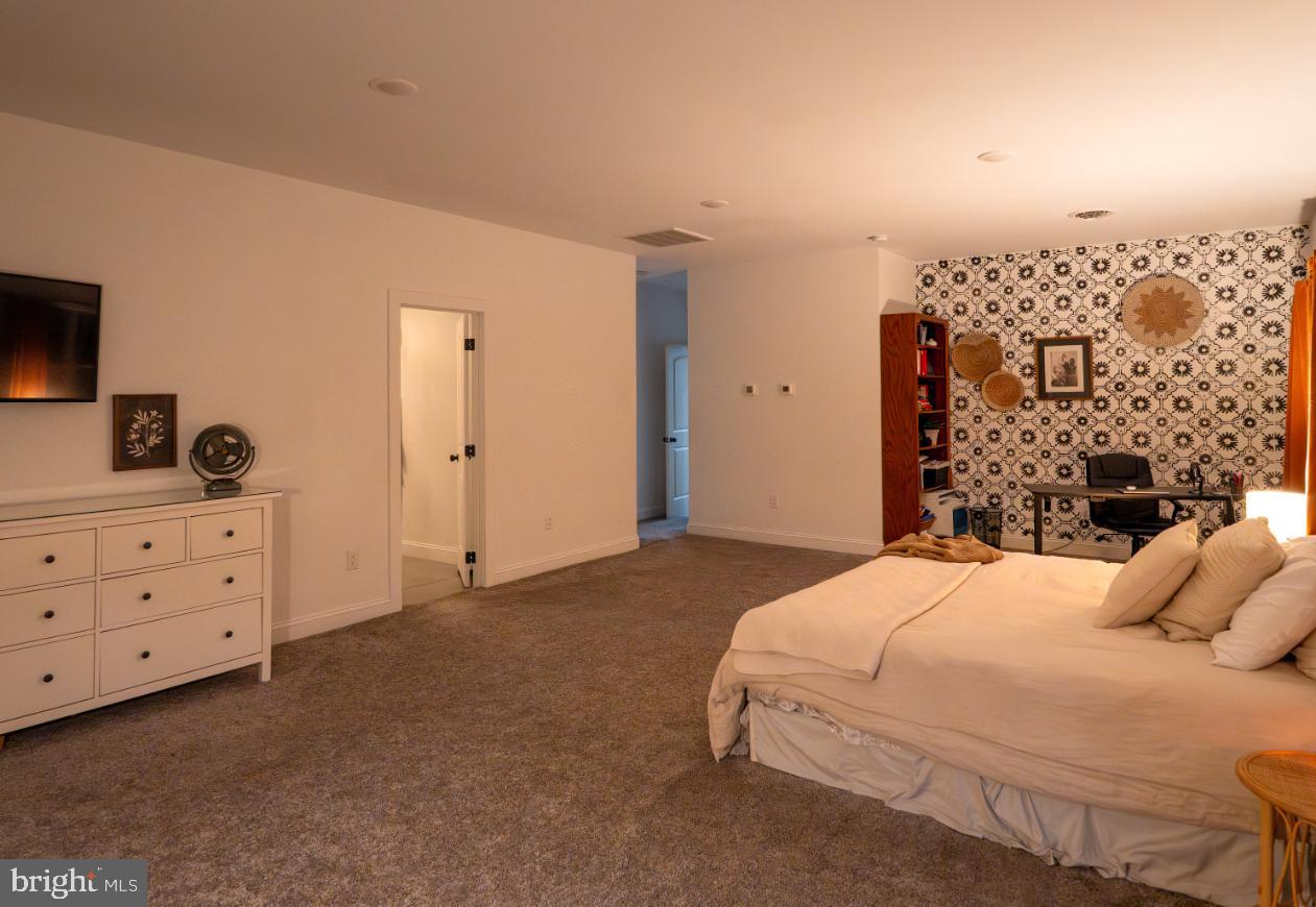 180 Gutshall Road Shippensburg, PA 17257 - Photo 11 of 37 a bedroom with a bed and a flat tv screen on dresser