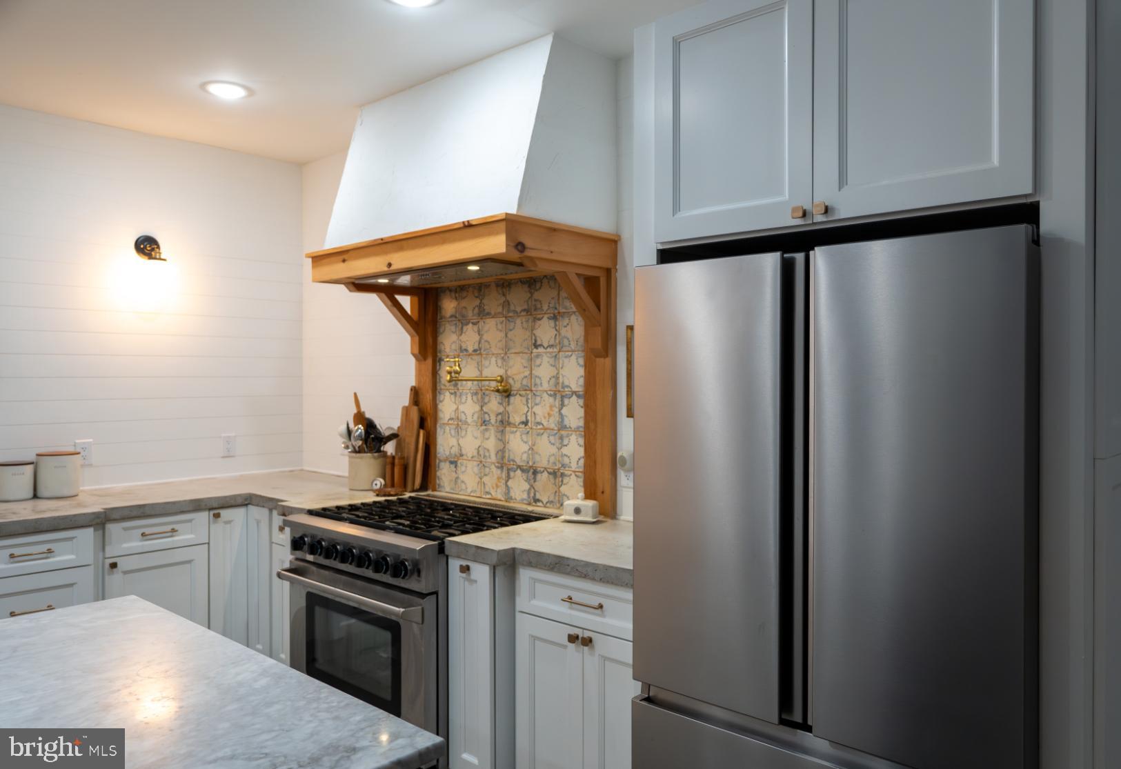 180 Gutshall Road Shippensburg, PA 17257 - Photo 18 of 37 a kitchen with stainless steel appliances granite countertop a refrigerator and a stove