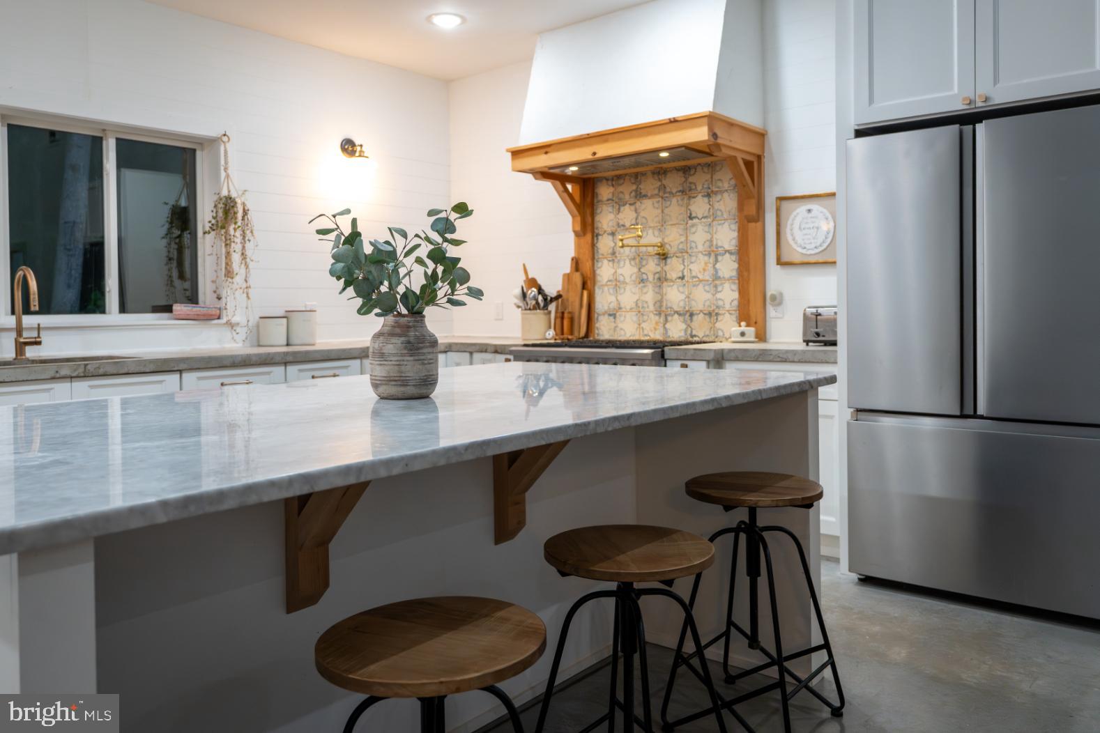 180 Gutshall Road Shippensburg, PA 17257 - Photo 19 of 37 a kitchen with stainless steel appliances a sink and a refrigerator