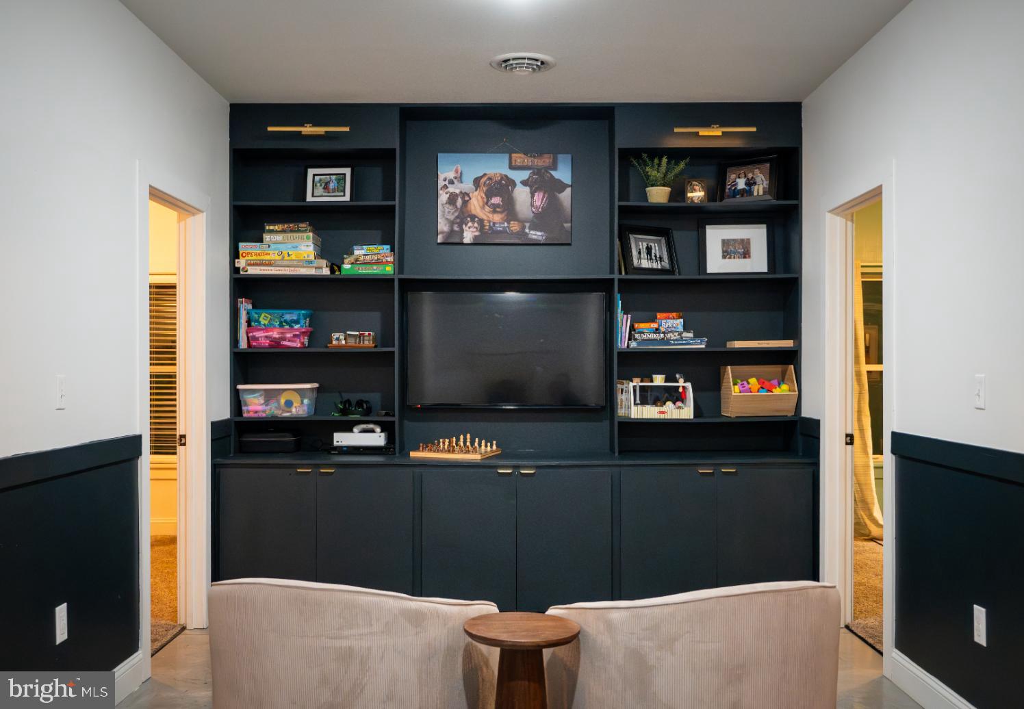 180 Gutshall Road Shippensburg, PA 17257 - Photo 24 of 37 a living room with storage and a flat screen tv