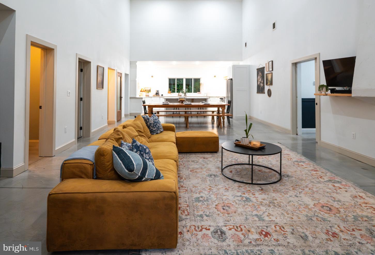 180 Gutshall Road Shippensburg, PA 17257 - Photo 3 of 37 a living room with furniture and a flat screen tv