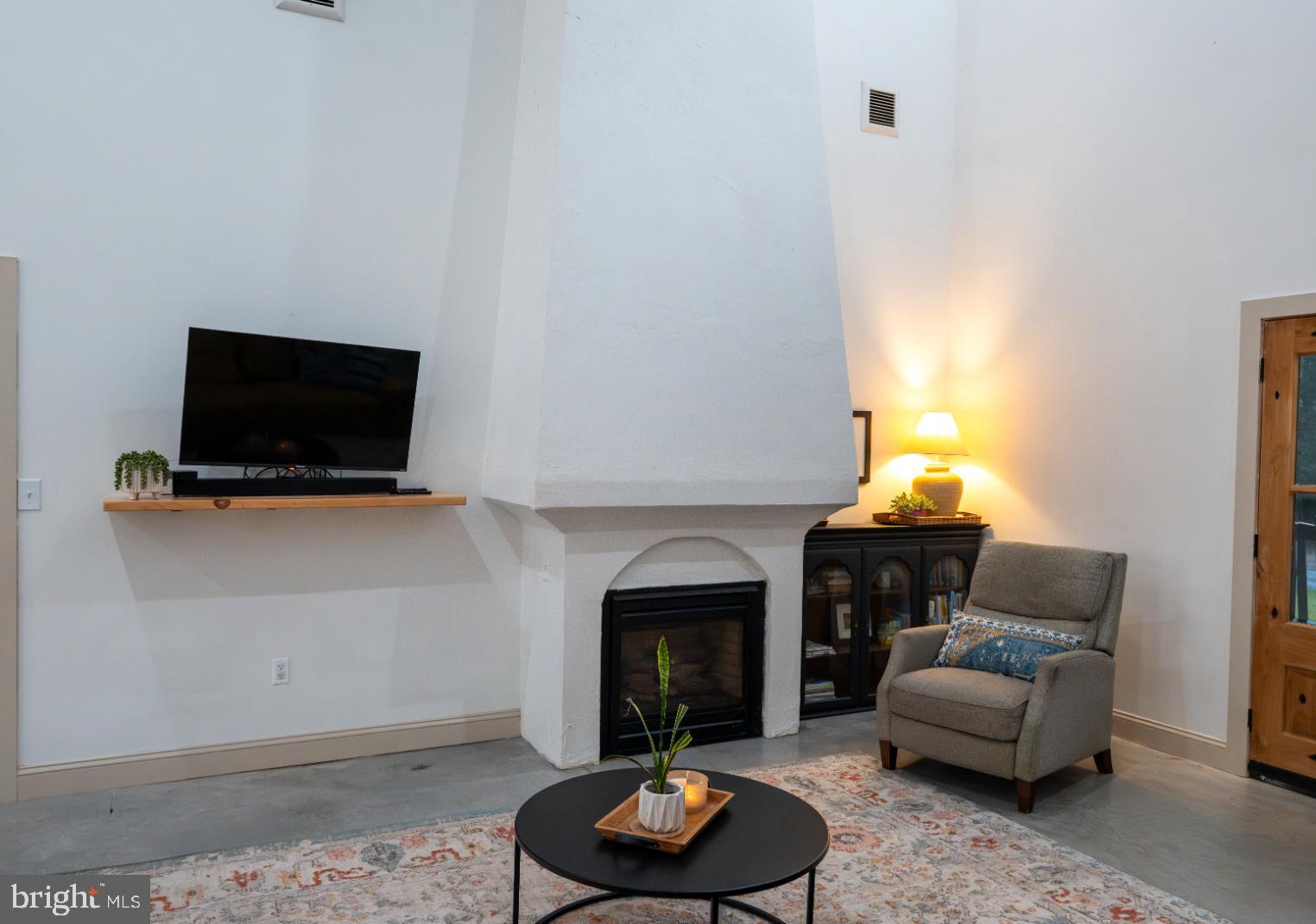 180 Gutshall Road Shippensburg, PA 17257 - Photo 6 of 37 a living room with furniture and a fireplace