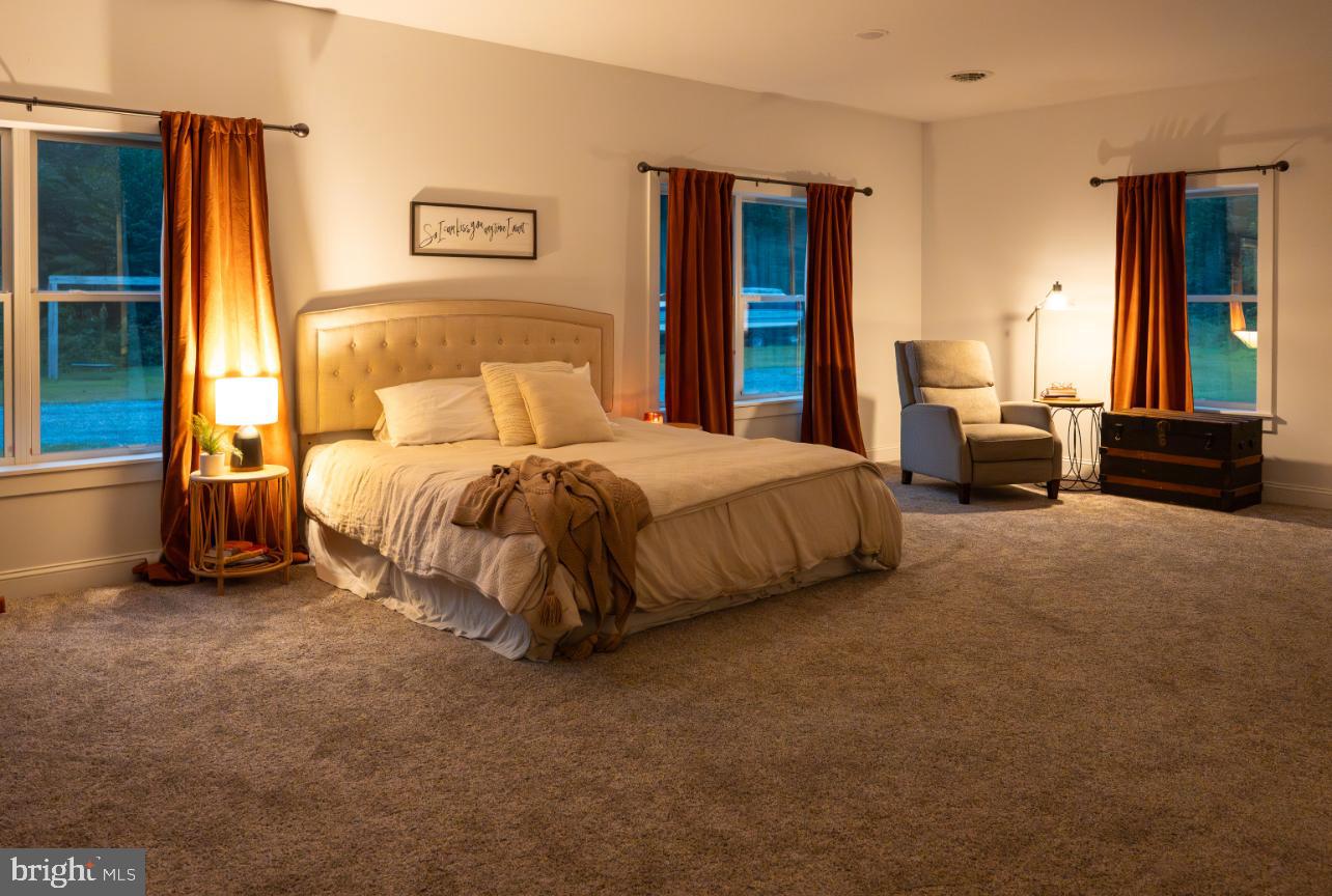 180 Gutshall Road Shippensburg, PA 17257 - Photo 9 of 37 a bedroom with a bed and a couch