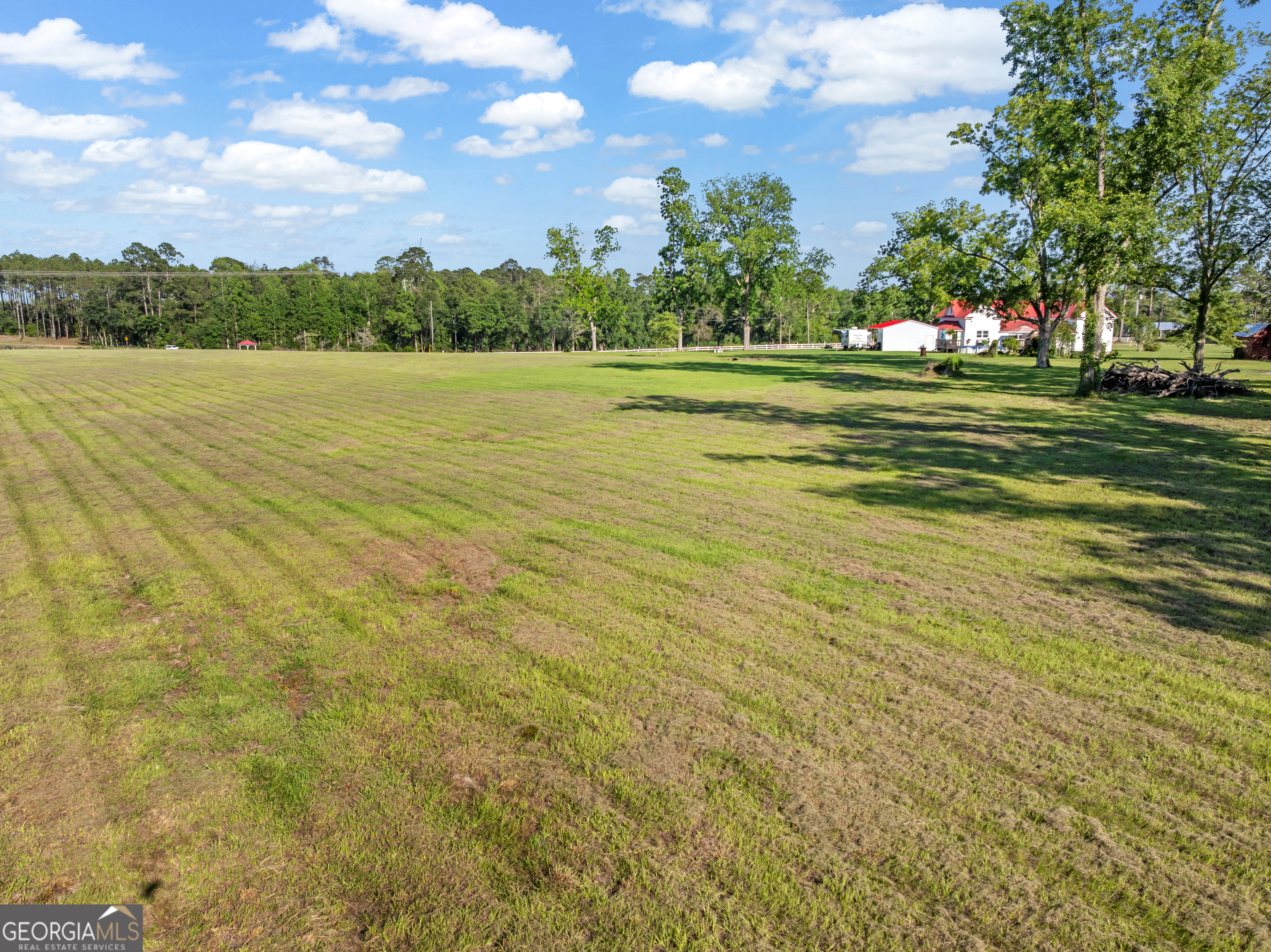 5065 10 Mile Road Baxley, GA 31513 - Photo 66 of 70 a view of a lake with a big yard