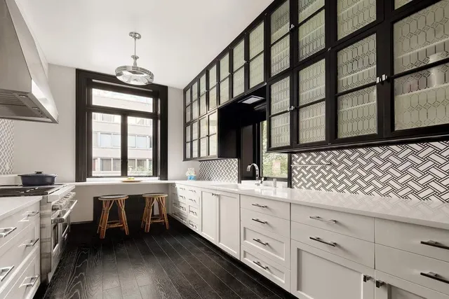 a kitchen with sink cabinets and window
