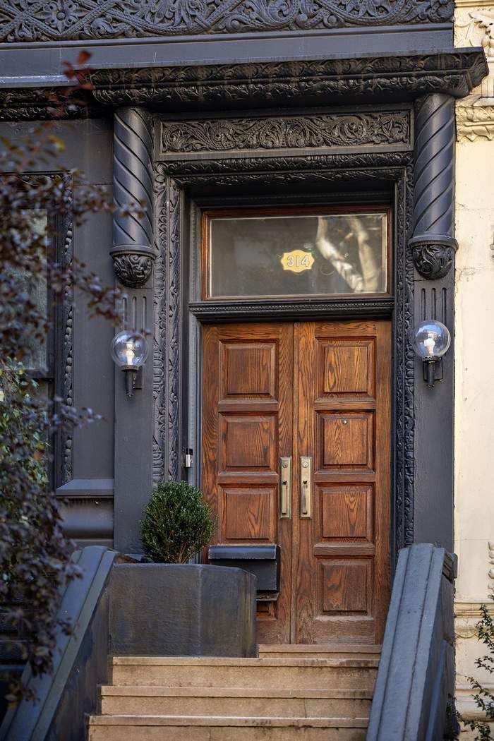314 West 71st Street Manhattan, NY 10023 - Photo 2 of 19 a living room with a fireplace and a potted plant