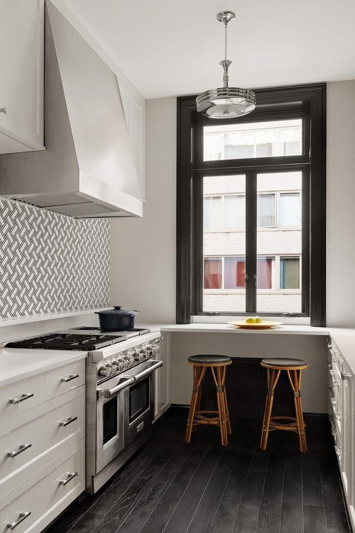 314 West 71st Street Manhattan, NY 10023 - Photo 9 of 19 a kitchen with a stove a sink and wooden floor