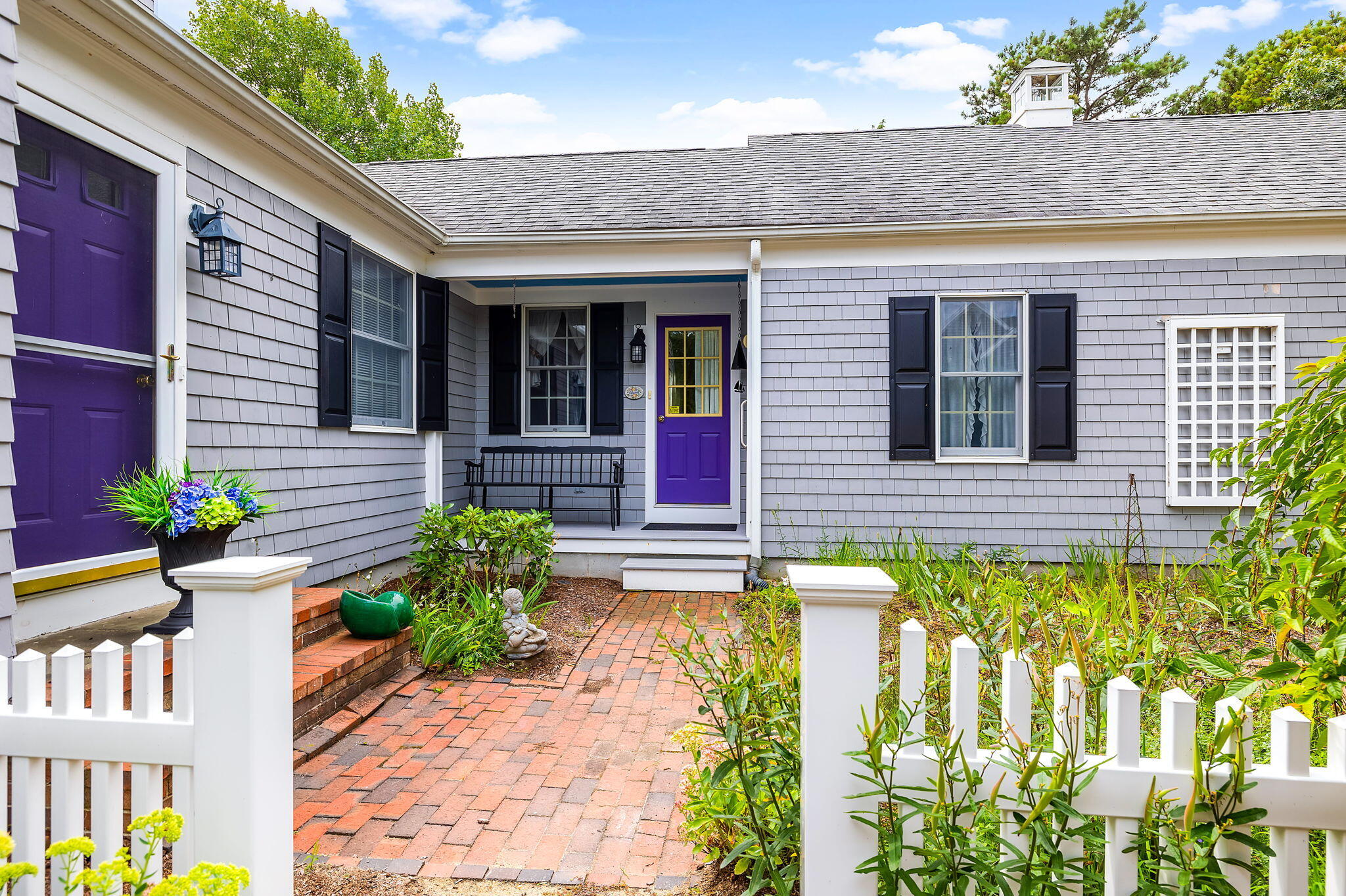 8 Seconsett Point Road Mashpee, MA 02649 - Photo 3 of 52 a front view of a house with a yard