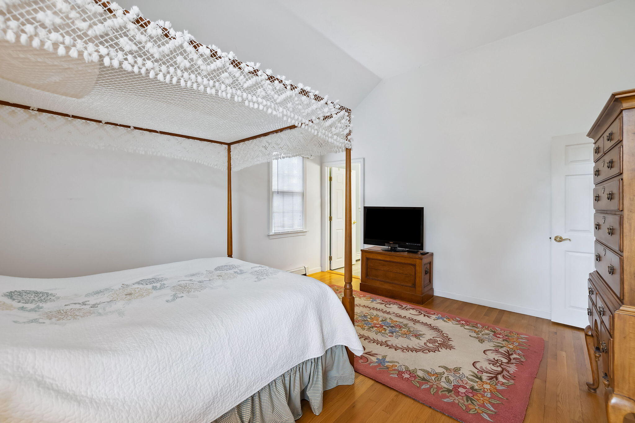 8 Seconsett Point Road Mashpee, MA 02649 - Photo 32 of 52 a bedroom with a bed and a flat screen tv