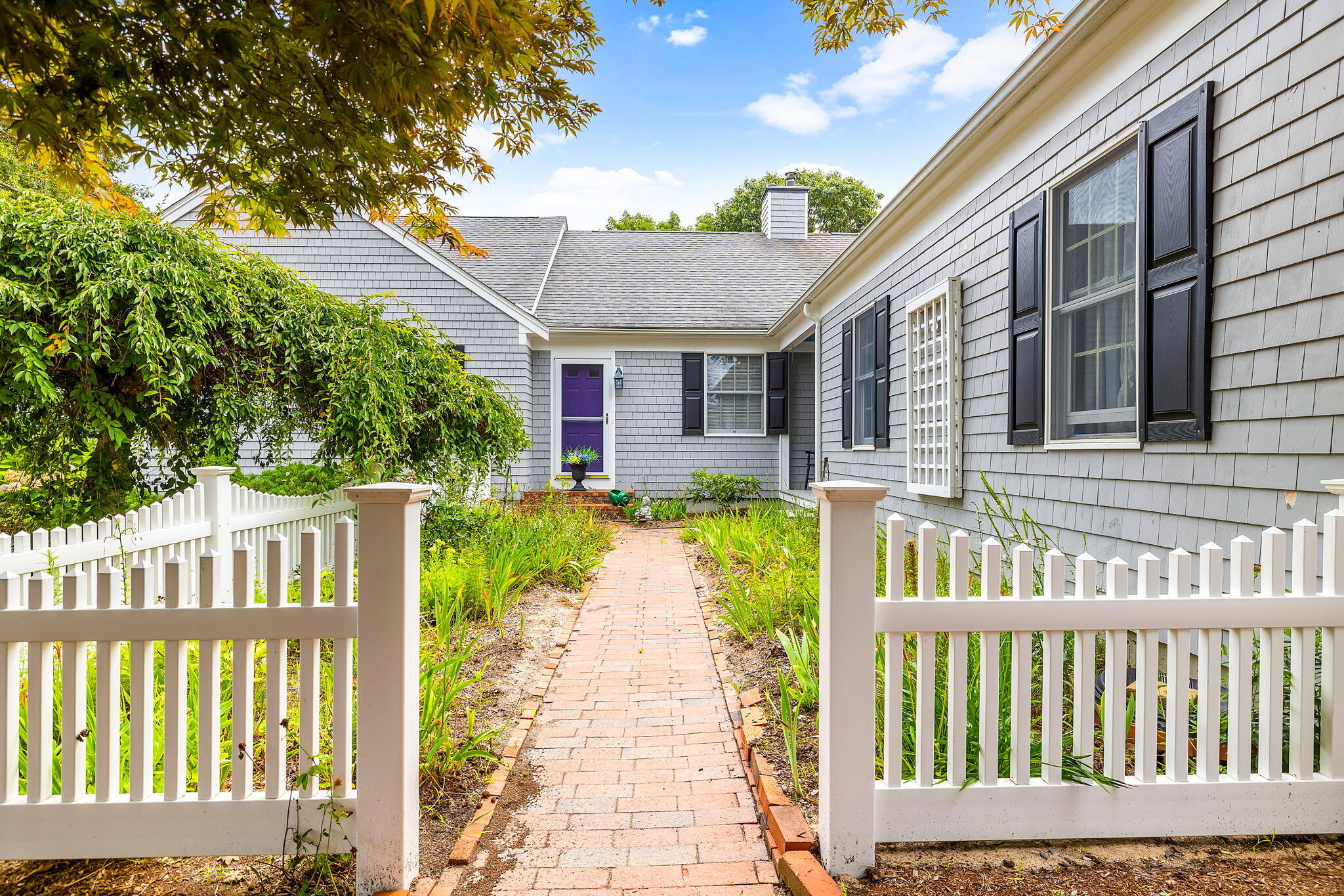 8 Seconsett Point Road Mashpee, MA 02649 - Photo 4 of 52 a front view of a house with a porch