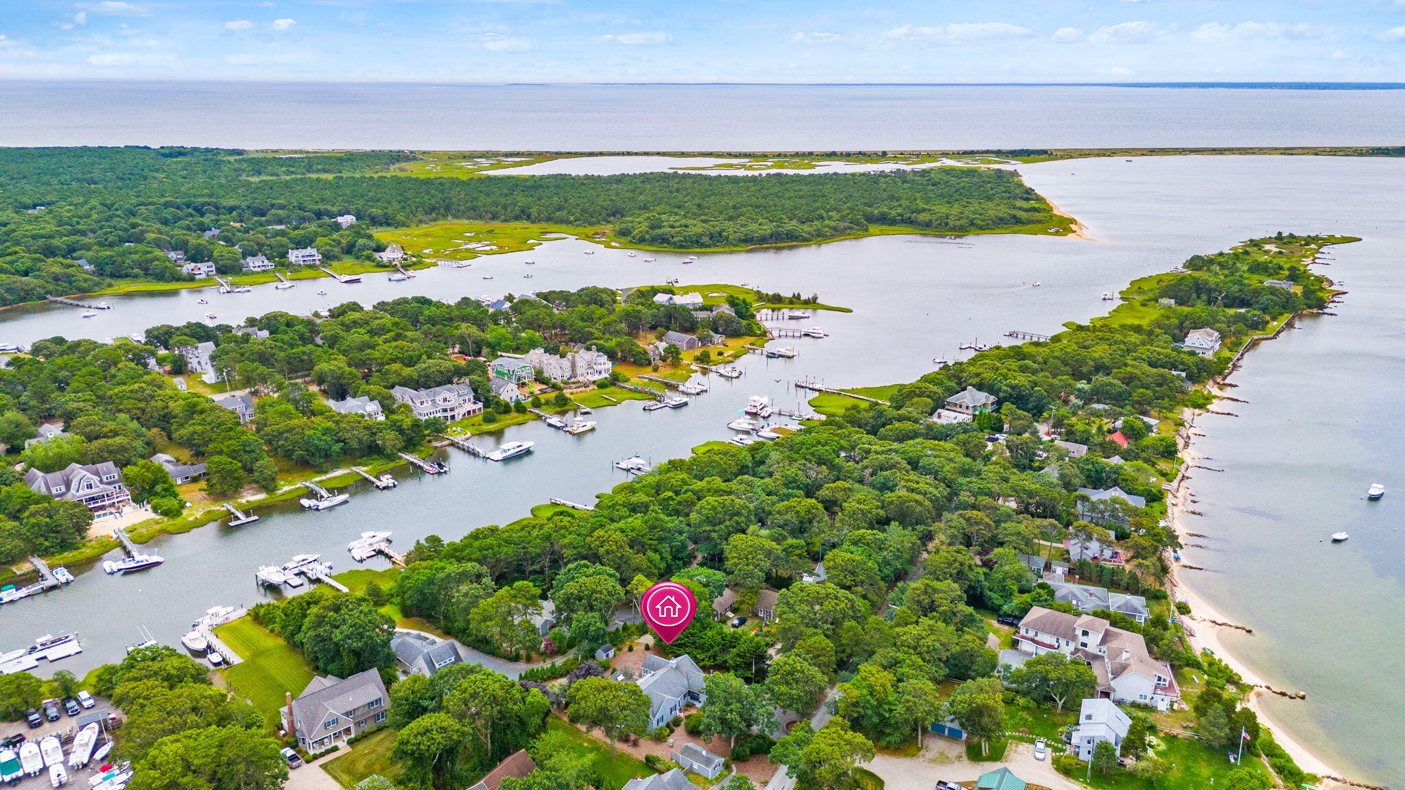 8 Seconsett Point Road Mashpee, MA 02649 - Photo 44 of 52 a view of a lake with a building in the background