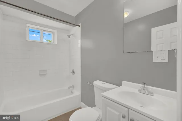 a bathroom with a sink toilet and bathtub