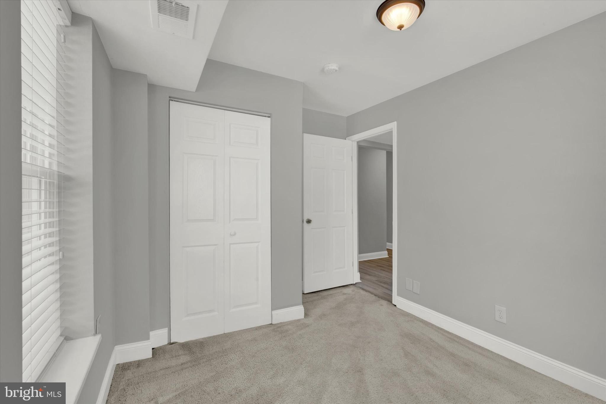 1679 Montello Avenue Northeast Washington, DC 20002 - Photo 26 of 38 an empty room with windows and closet