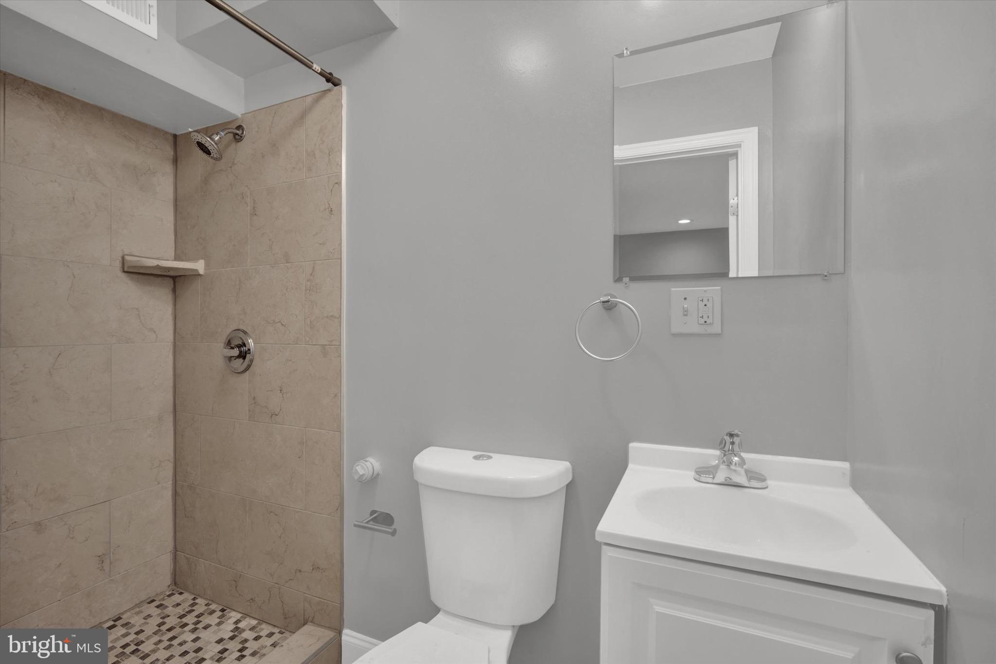 1679 Montello Avenue Northeast Washington, DC 20002 - Photo 31 of 38 a bathroom with a sink toilet and shower