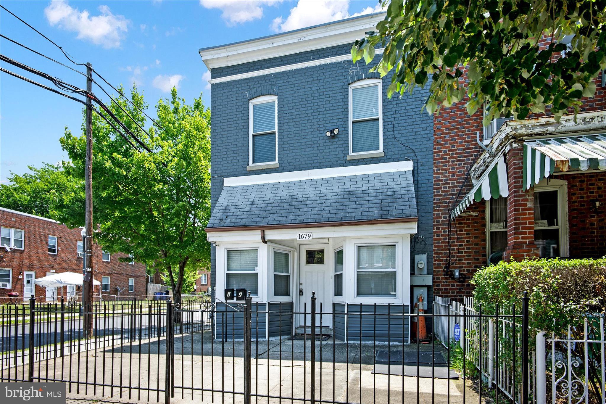 1679 Montello Avenue Northeast Washington, DC 20002 - Photo 4 of 38 a front view of a house with a porch