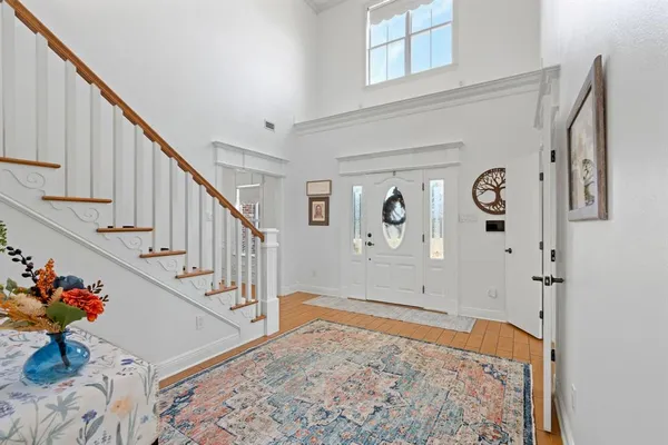 a view of entryway with wooden floor