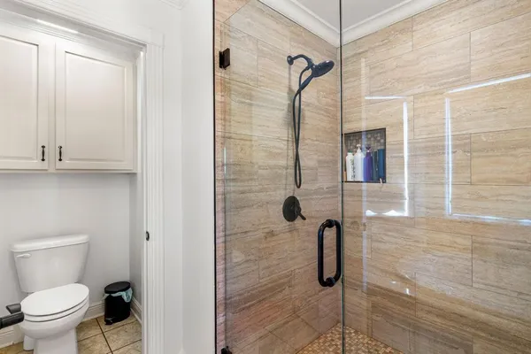 a bathroom with a granite countertop sink mirror and bathtub
