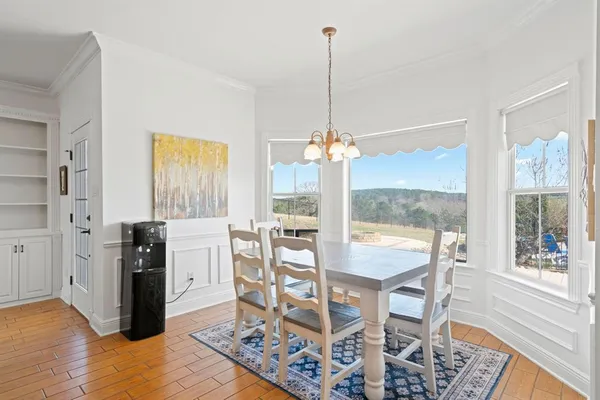 a large kitchen with stainless steel appliances and a large window