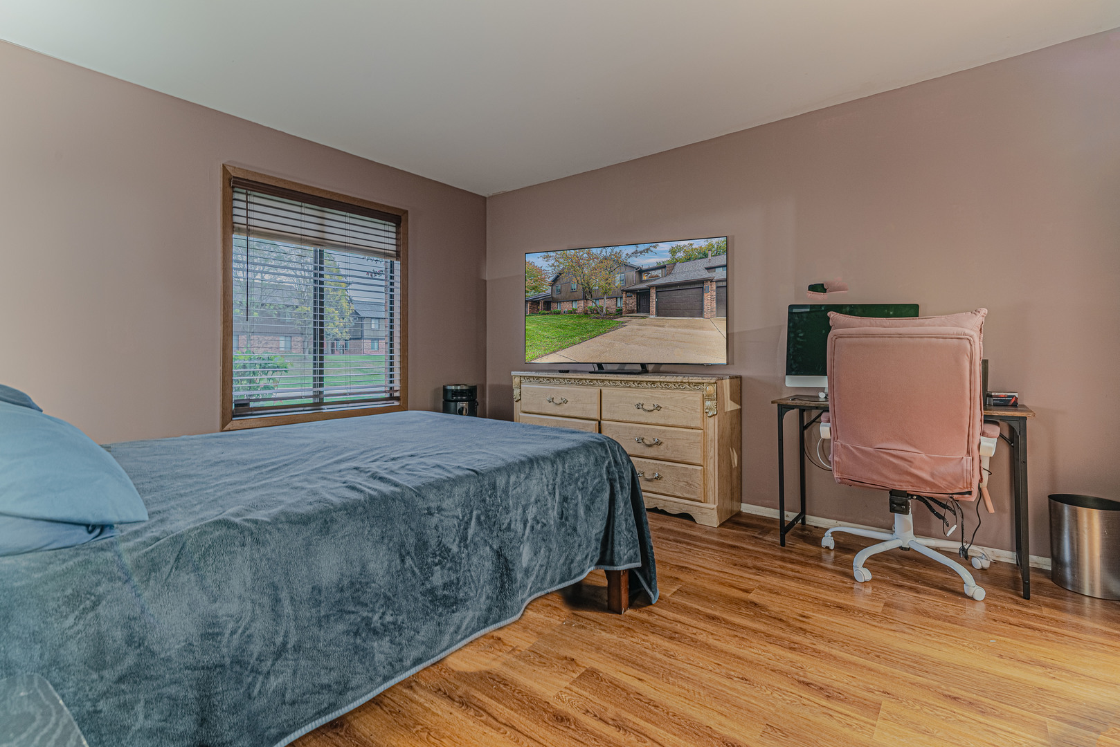 5 Creekside Circle, Unit B Elgin, IL 60123 - Photo 14 of 25 a bedroom with a bed a desk and chair with wooden floor