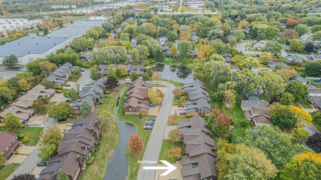 an aerial view of houses with yard