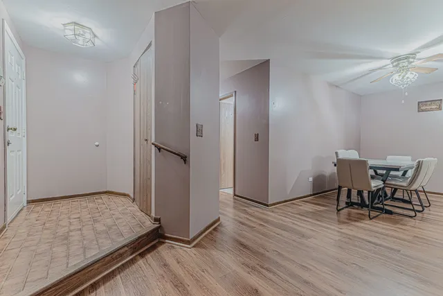 a view of room with furniture and wooden floor