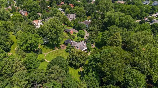 a view of a house with a tree